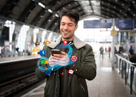 Person using phone in German train station